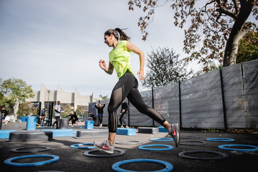 A person engaging in a balanced workout routine outdoors, showcasing a blend of exercise, nutrition, and mindfulness.