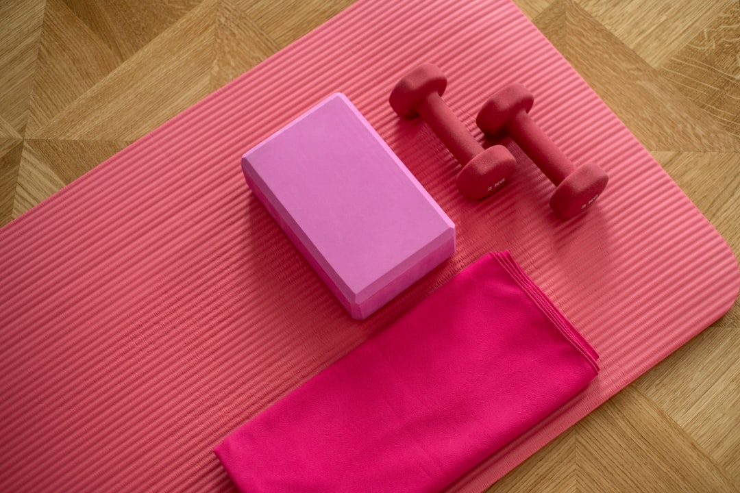 A diverse group of people engaging in various workout activities, including strength training, cardio exercises, and stretching in a gym or outdoor setting.