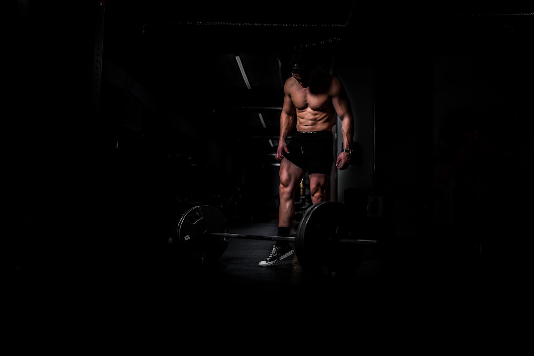 A person exercising outdoors, looking determined and focused, with a scenic background that conveys a sense of progress and perseverance.